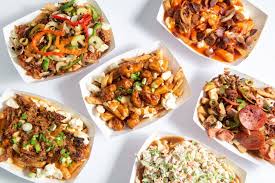 Variety pack of different types of poutine against a white background